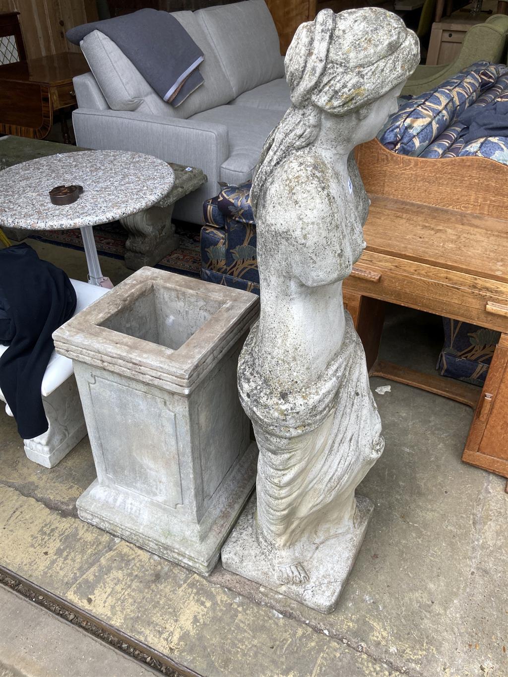 A reconstituted stone garden ornament of Venus on pedestal base, height 192cm